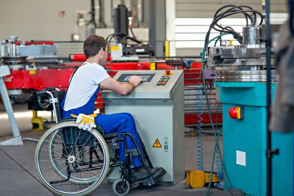 man in wheelchair working