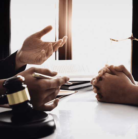 people talking at a desk