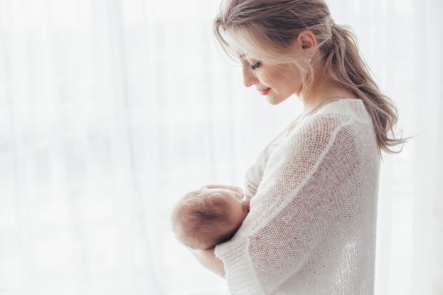 image of a mother holding a child