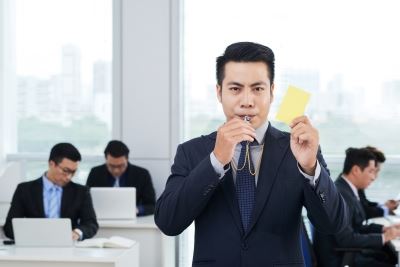 man in an office with a whistle 