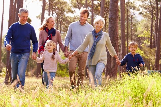 family walking through the woods