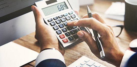 man using calculator